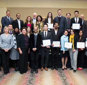 Members of the Chicago Consular Corps pose with UIC student scholarship winners.
                  