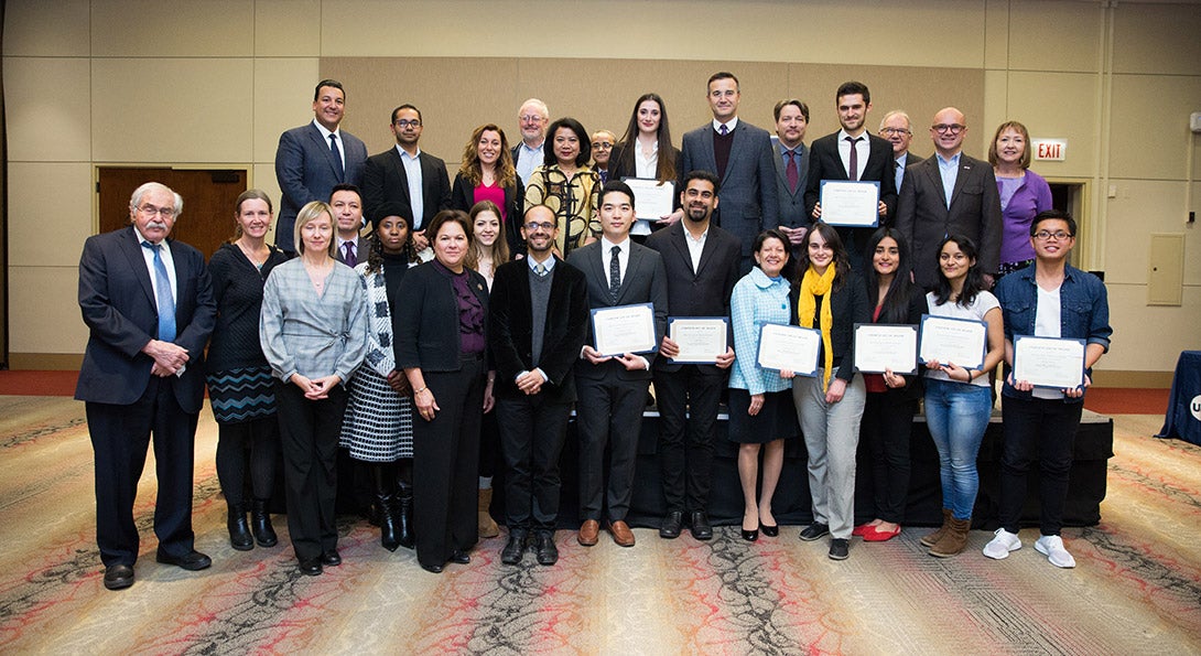 Members of the Chicago Consular Corps pose with UIC student scholarship winners.