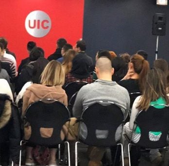 UIC students listen to a presentation given by the Consul General of Argentina.
                  