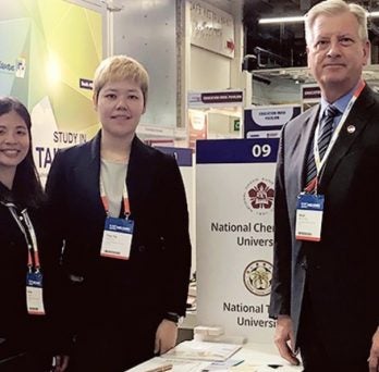 Dr. Neal McCrillis with delegates Kitty Chen and Tzu-yu Huang
                  