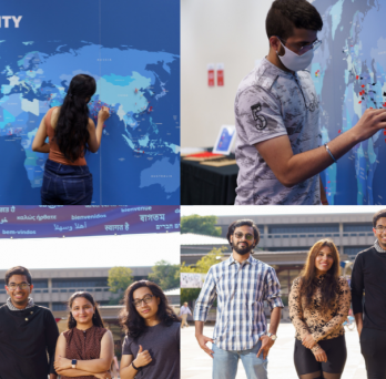 Students place their pins on the Global Community Map. The Global Ambassadors pose in front of the large multi-lingual welcome banner in the Quad.
                  