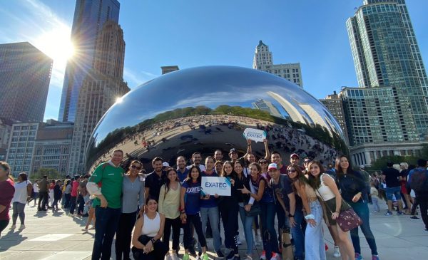 Students standing in front of the Bean