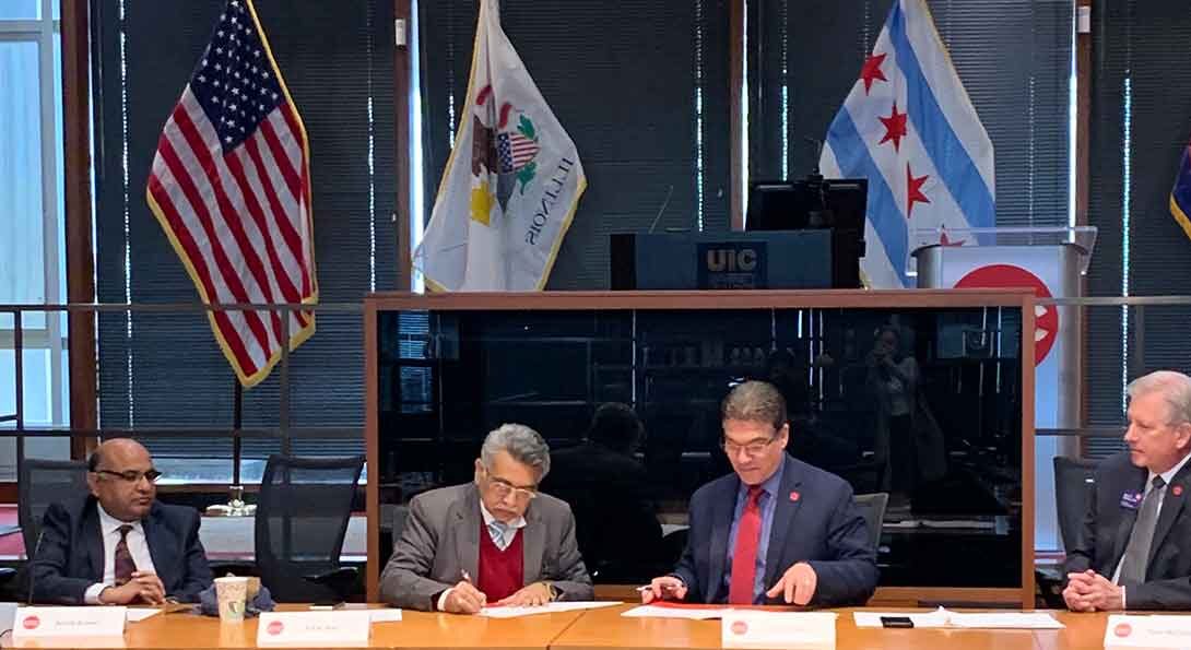UIC Chancellor Javier Reyes and SPA Director P.S.N. Rao sign a memorandum of agreement